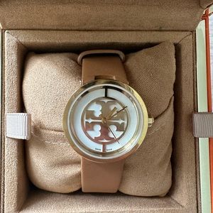 Like-new Tory Burch wrist watch. Comes with original packaging.